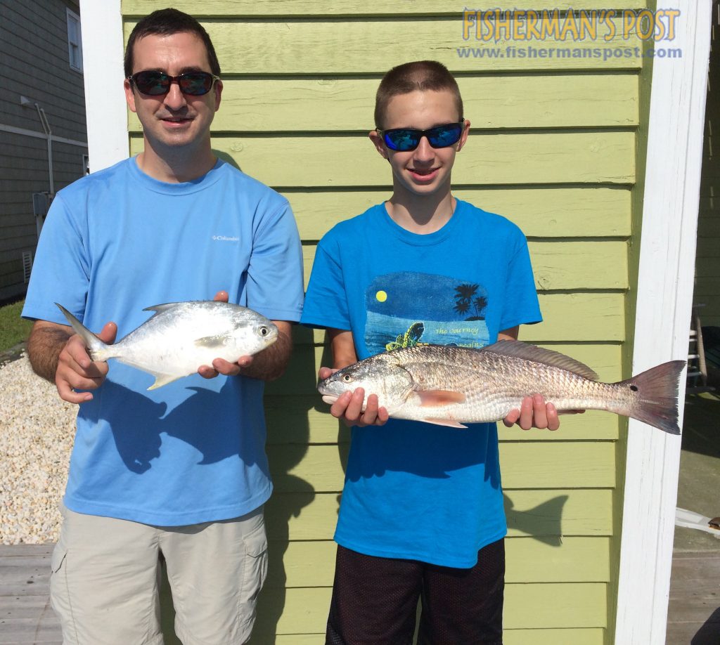 Thomas Kriston and Caleb West, of Lumberton, NC, with a 13" pompano and a 23" red drum they caught in the Holden Beach surf. The pompano bit shrimp and the red a finger mullet.