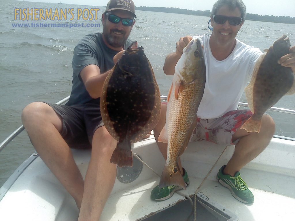 Max Gaspeny (left) and Gary Hurley with a red drum and two of the flounder they caught while fishing live bait inshore in the Southport area. They were fishing the Southport waterfront, area creeks, and the lower Cape Fear River with Capt. Mark Register of Playin' Hooky Charters.
