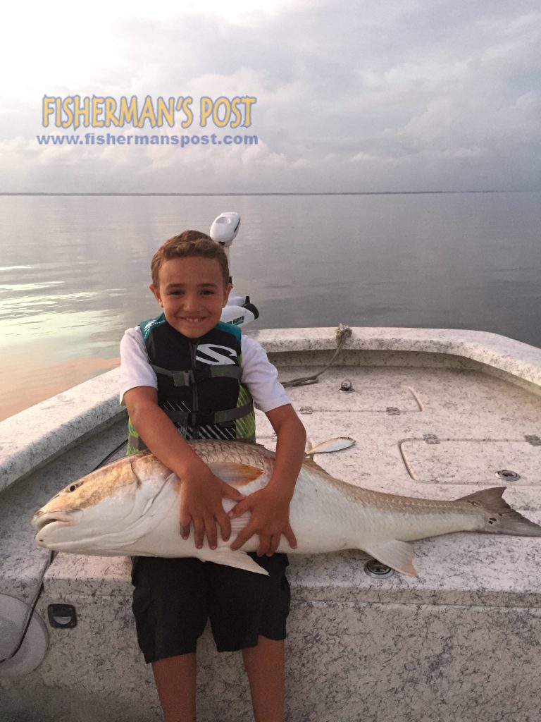 Bryce Jackson with his first citation-class red drum, caught while fishing with his father, Capt. Jack Jackson of FinchasersUSA.