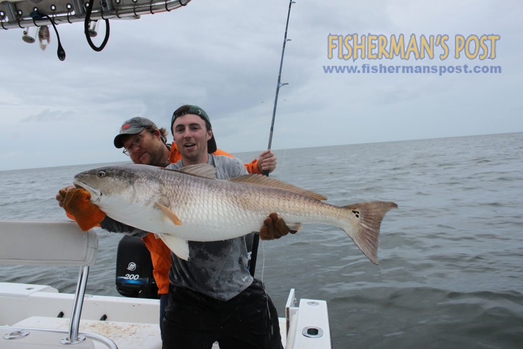 Capt. Pat Jones and Wyatt Dickson with a citation-class red drum that struck a chunk of mullet while they were fishing our of Cedar Island.