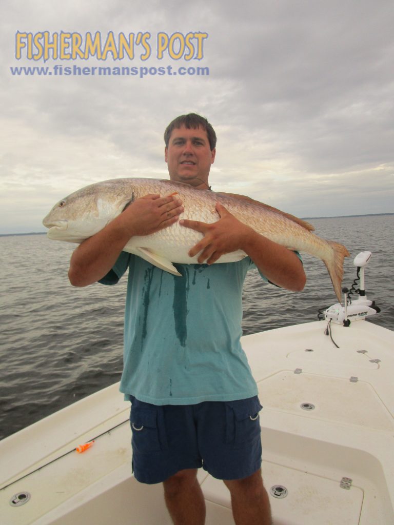 Chris Suggs, of Snow Hill, NC, with a citation red drum he caught and released after it struck a D.O.A. swimbait beneath a popping cork while fishing the lower Neuse River with Capt. Dave Stewart of Knee Deep Custom Charters.