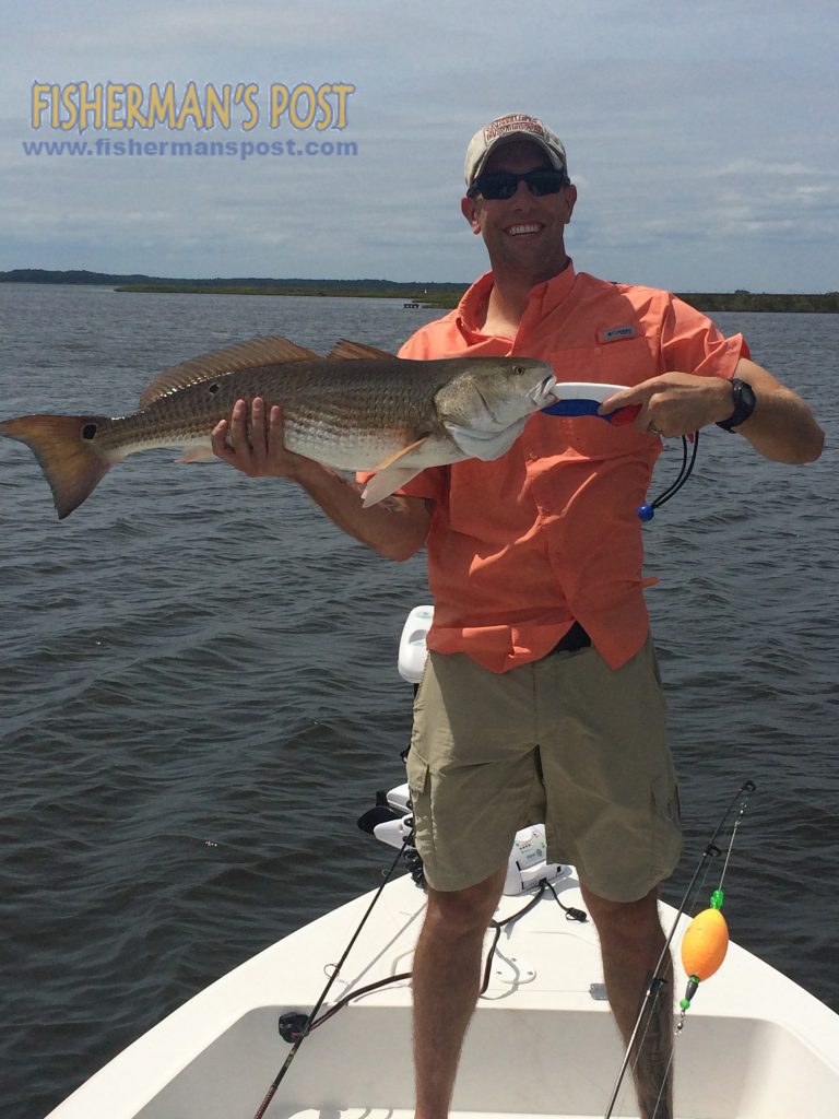 Kyle Dubois with a 31" red drum that bit a Z-Man soft plastic under a popping cork near a grass line at Point of Marsh.