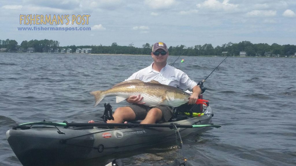 Eric Dudleck with a citation-class red drum he hooked on a D.O.A. Clacker/Airhead combo while paddling the Neuse River off Oriental.