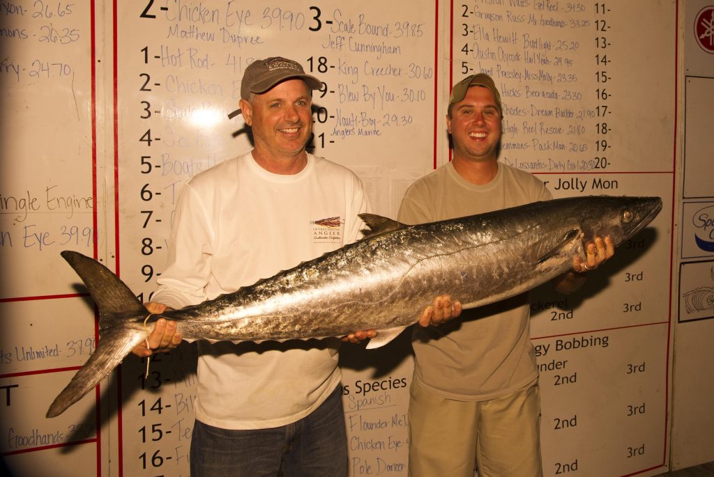 Brett and Alan Barnes, of the "Hot Rod" fishing team with the 41.85 lb. king mackerel that earned them first place in the 2015 Fall Brawl King Classic. The big mackerel struck a naked menhaden on top near Ocean Crest Pier.
