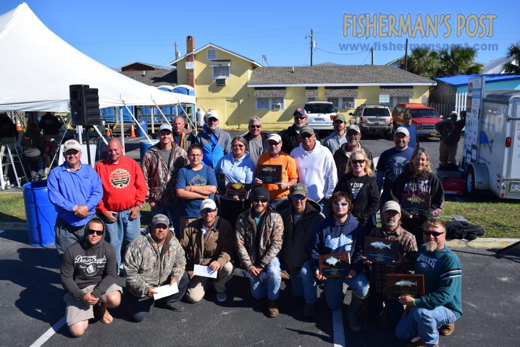 The winners of the 2015 Pleasure Island Surf Fishing Challenge pose with trophies, plaques, and checks totaling over $22,000. The event attracted 470 anglers to Carolina Beach, Kure Beach, and Fort Fisher over the weekend of Oct. 16-18.