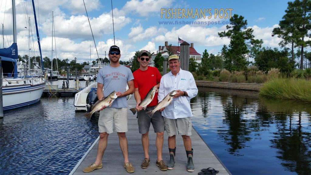 Luke, Trent, and Rusty Huffines with a trio of slot red drum that bit a silver Rat-L-Trap while they were casting from the dock at River Dunes Marina in Oriental.