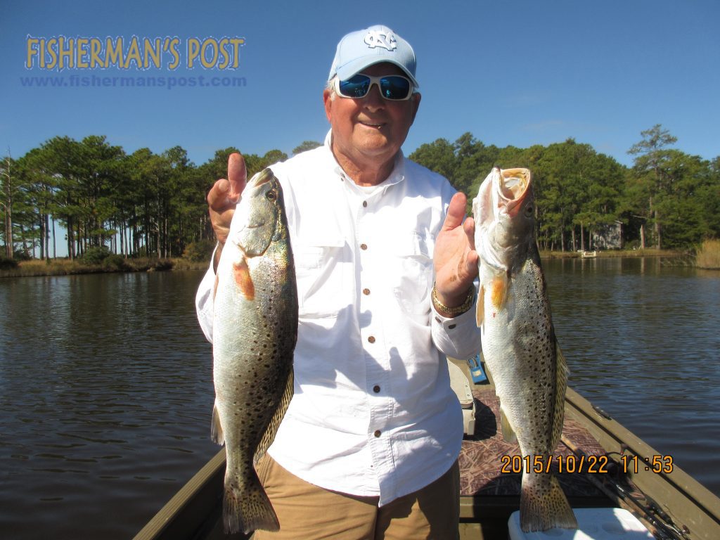 Curtis Pelt, of Rocky Mount, NC, with a pair of speckled trout that bit Vudu Shrimp under popping corks while he was fishing a creek off the Neuse River.