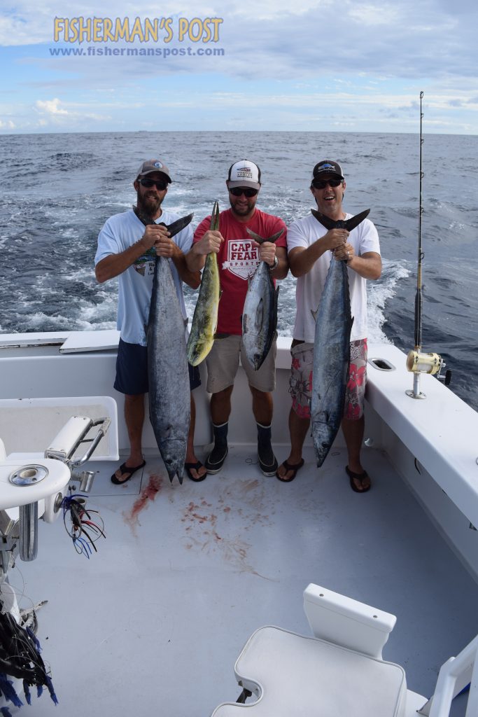Scott Wallen, J.J. Khoury, and Gary Hurley with a pair of wahoo, a dolphin, and a blackfin tuna that attacked ballyhoo under sea witch and Ilander skirts in the wake of the "Dancin' Outlaw."