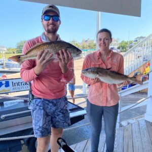 Cole Fowler and Madison York, two of the members of Team Fowler, with the two red drum that earned them a second place finish in the 2023 Inshore Trail Championship. The fish were caught on a mix of mullet and menhaden.